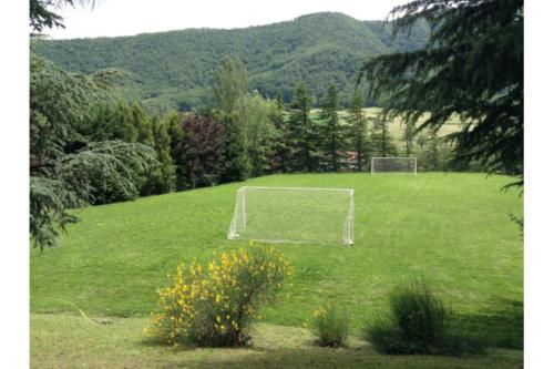 a field with a soccer goal in the middle of a field at B&B CorteBonomini entire home in Sasso