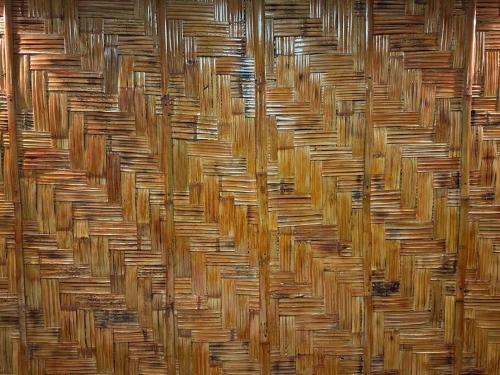 a row of wicker baskets in a wall at Amakan Beachfront Private House Bataan in Bagac