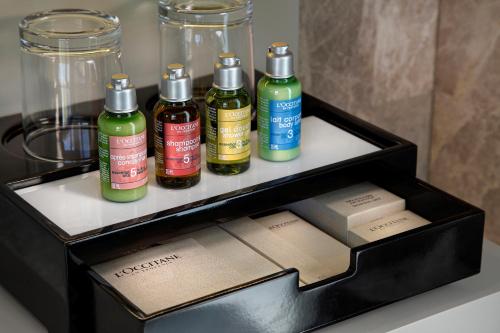 a black box with four bottles of hair products at Wanda Vista Istanbul in Istanbul