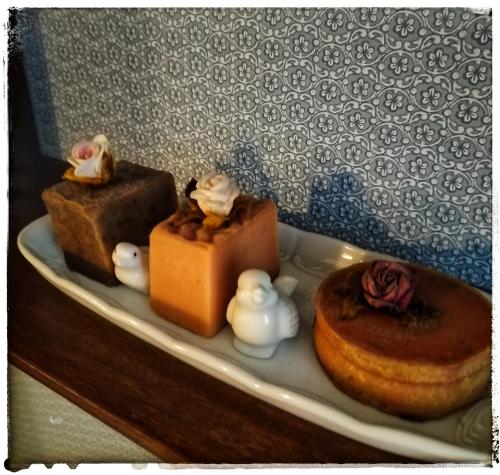 a plate with three different types of desserts on it at Ferienwohnung Landidylle in Zodel