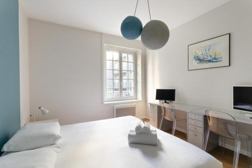 Postel nebo postele na pokoji v ubytování Chez Léon - Appt à 500m des plages