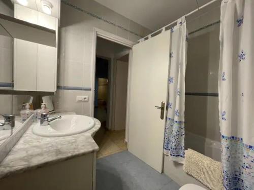 a bathroom with a sink and a shower at Villa Antonia in Cap d'en Font