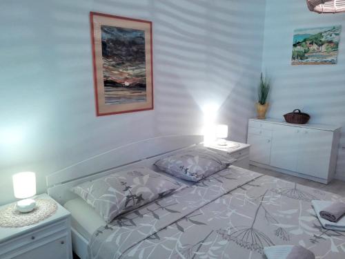 a bedroom with a bed and two night stands at Center Flat in Vis
