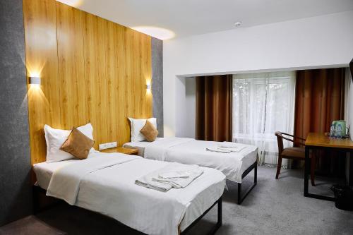 Voodi või voodid majutusasutuse Art Plaza Hotel toas