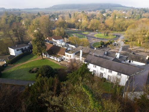an aerial view of a house in a village at Sunday Box Hill Burford Bridge Hotel in Dorking