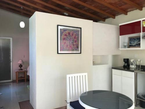 a kitchen with a table in a room at Casita Primavera / Casa Comalli in Comala
