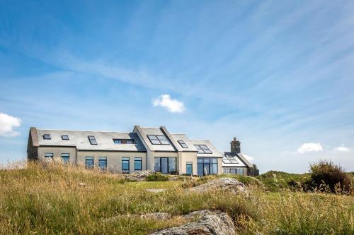 a house on the top of a hill at Doleen House in Ballyconneely