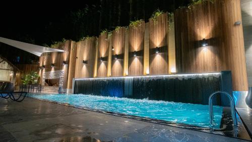 a swimming pool with a water feature in a building at Dosso Dossi Hotels & SPA Golden Horn in Istanbul