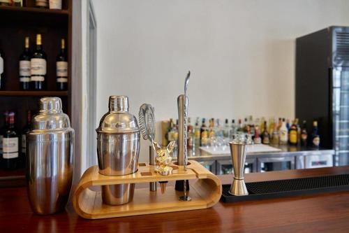 a counter with two blenders on top of a bar at My BanLao Hotel in Luang Prabang