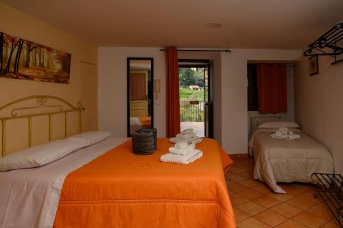 a bedroom with two beds with towels on them at Mirose's holiday home 39 in Castelbuono