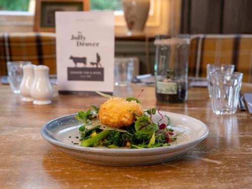 a plate of food on top of a table at The Jolly Drover in Liss