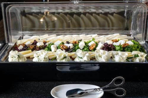 a plastic container filled with different types of food at Urban Boutique Hotel in Tbilisi City