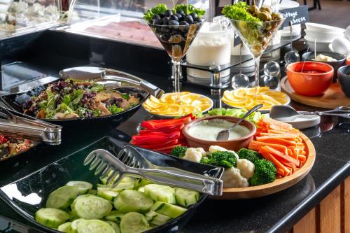a buffet with a bunch of different types of food at Urban Boutique Hotel in Tbilisi City