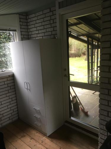 a room with a door and a window at Harvey`s Bed & Breakfast in Hjørring