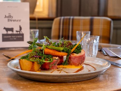 a plate of food sitting on a table at The Jolly Drover in Liss