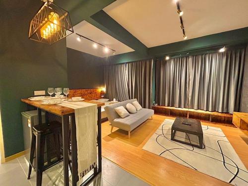 a living room with a bar in the middle of a room at imperium residence kuantan in Kuantan