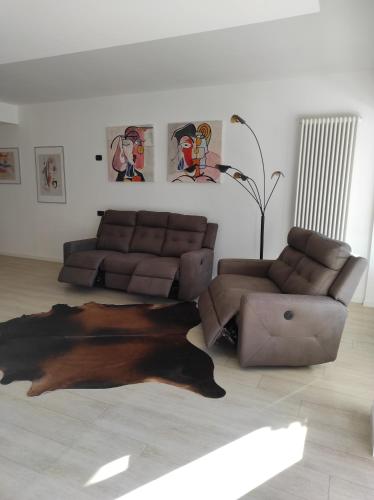 a living room with a couch and a dog rug at Appartamento al Sereno in Luino