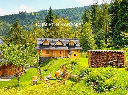 a house in the middle of a green yard at Dom pod Baranią - Wisła - sauna, jacuzzi, tężnia & widok na góry in Wisła