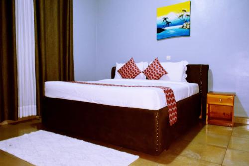 Una cama o camas en una habitación de GARDEN INN by AIRPORT inn ltd