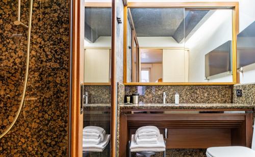 a bathroom with a sink and a shower at Nicchia in Verona