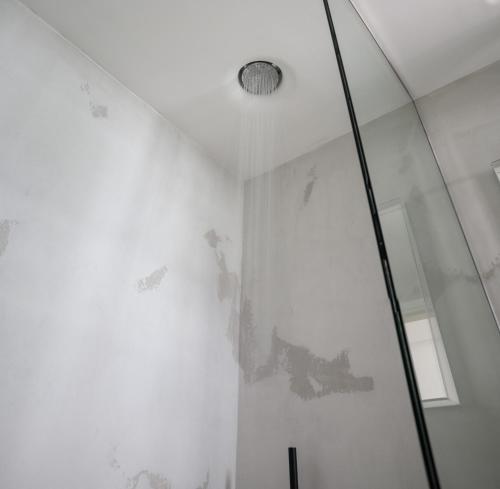 a shower with a glass door and a ceiling at Afroditi Venus Beach Resort in Kamari