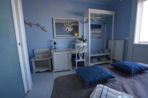 Postel nebo postele na pokoji v ubytování B&B Sogno D'Estate