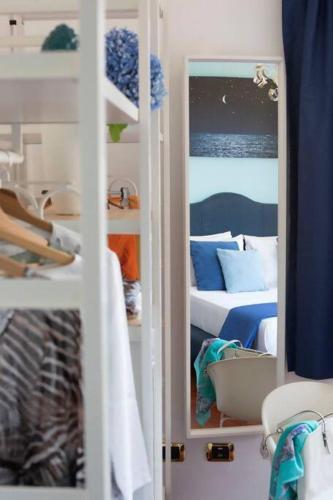 a room with two bunk beds and a room with a bed at Alpa Suite in Sant'Agnello