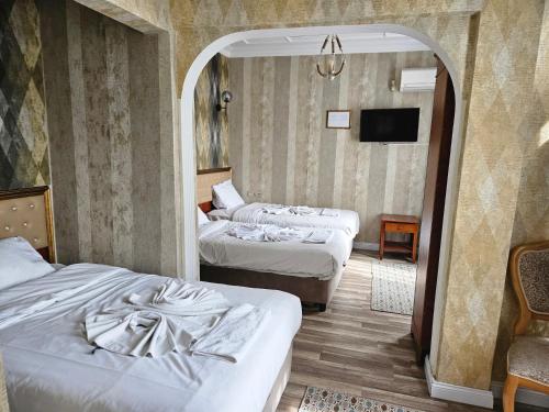 Postel nebo postele na pokoji v ubytování Asitane City Life Hotel