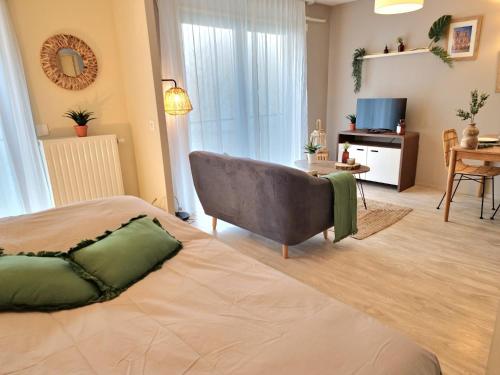 Postel nebo postele na pokoji v ubytování Résidence de Maisons-Laffitte