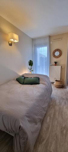 Postel nebo postele na pokoji v ubytování Résidence de Maisons-Laffitte