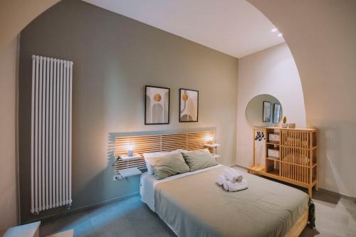 a bedroom with a large bed in a room at Sea Glow Luxury Apartment 2BR 2BA con vista mare a Bisceglie in Bisceglie