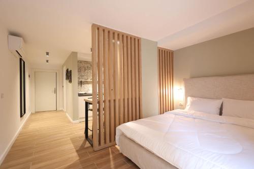 Ένα ή περισσότερα κρεβάτια σε δωμάτιο στο Grandstay Studios
