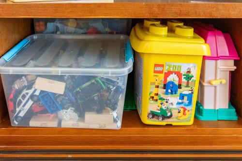 a drawer filled with lego toys and a plastic container at Warm Residence in the heart of the City Center - Balcony & view in Nicosia