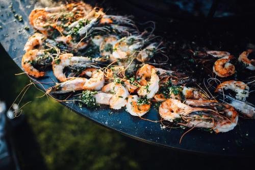 a bunch of shrimp on a plate on a grill at Broløkke Herregård in Humble