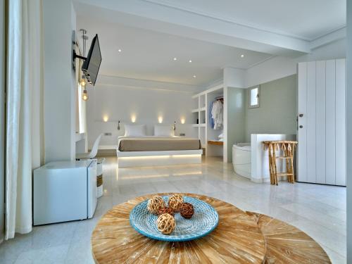 a living room with a table with two donuts on it at Kanale's Rooms & Suites in Naousa