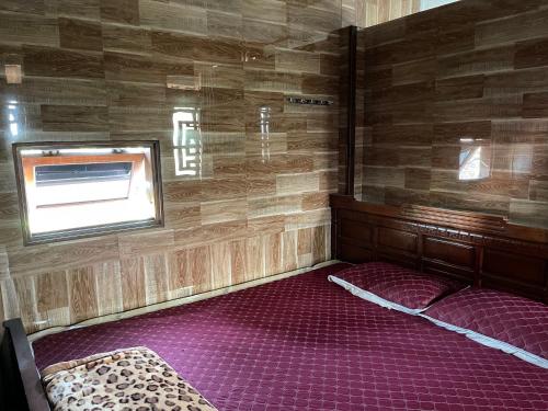 Ένα ή περισσότερα κρεβάτια σε δωμάτιο στο Phố Thiên Đường Homestay