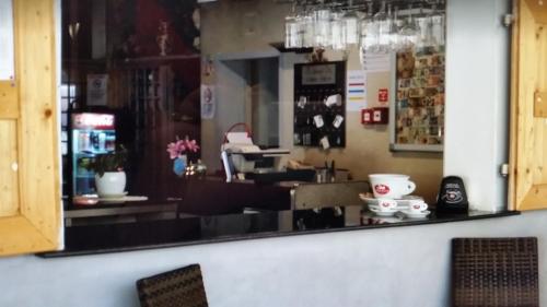 a large mirror on the wall of a store at Hotel AnnaMare in Rimini