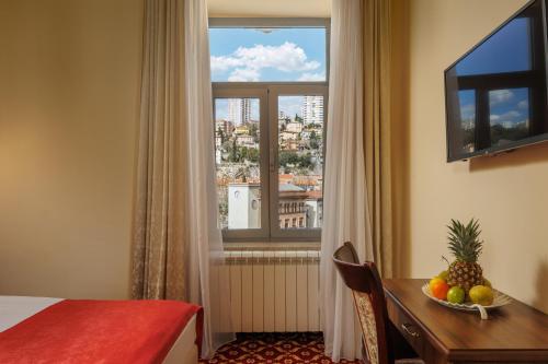 Postel nebo postele na pokoji v ubytování Hotel Continental