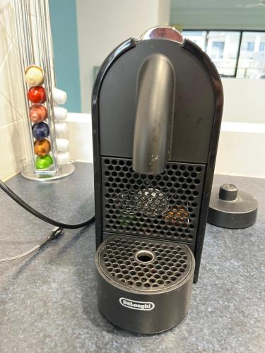 a toaster sitting on top of a counter at Moana Seaside Retreat - 2 Bedroom, spa , living area & pet friendly in Moana