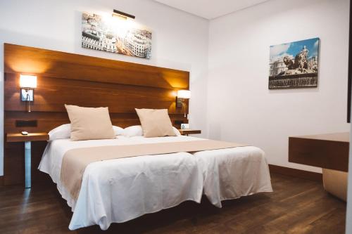 Postel nebo postele na pokoji v ubytování Ferreira Hostal Boutique