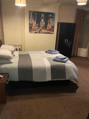 a hotel room with a bed with towels on it at The Bowmans in Howden