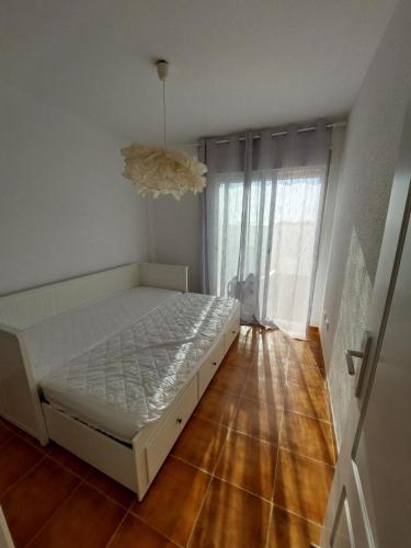 a bedroom with a bed and a large window at HACIENDA DEL MARQUES III To Chill in Cuevas del Almanzora