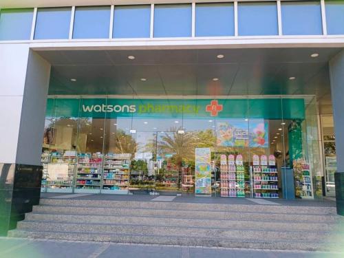 a store front of a woolworths store at Mactan Newtown Beach Condo in Mactan