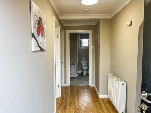 a hallway with a toilet in a room at 5 Berth Dog Friendly Lodge In Hunstanton By The Beach Ref 13015rn in Hunstanton