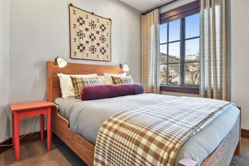 a bedroom with a bed and a window at Flagstaff #203 in Park City