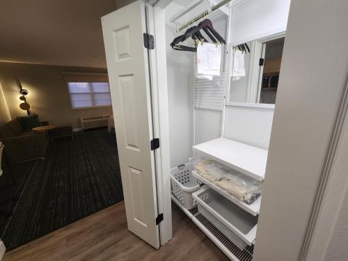 an empty refrigerator with its door open in a room at TownePlace Suites by Marriott Killeen in Killeen
