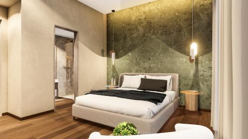 a bedroom with a white bed and a green wall at Arthur Suites in Old Town in Rhodes Town