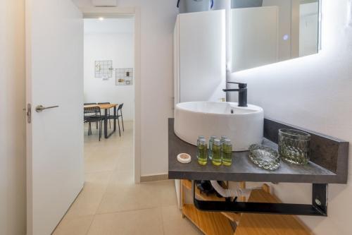a bathroom with a sink and a mirror at 2 bedrooms 1 bathroom furnished - Lavapies - Modern Cozy - MintyStay in Madrid
