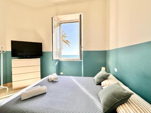 En eller flere senge i et værelse på Hostdomus - Sea and Sand Suite