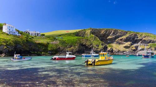 a group of boats sitting in the water at Homestead in Port Isaac